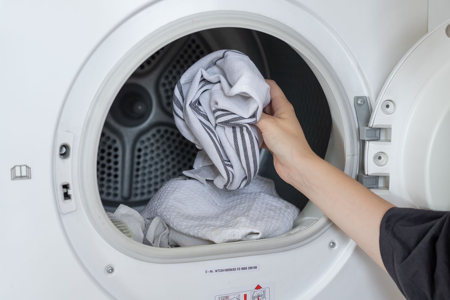 Old rags placed in dryer machine to soften wax