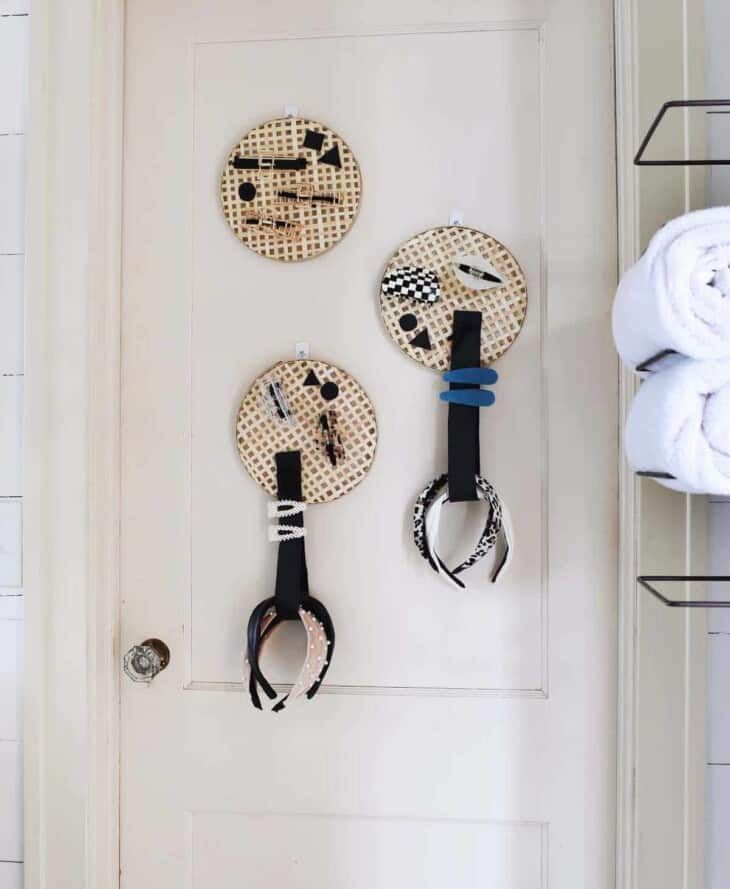 Hair organizers hung on a door in the bathroom