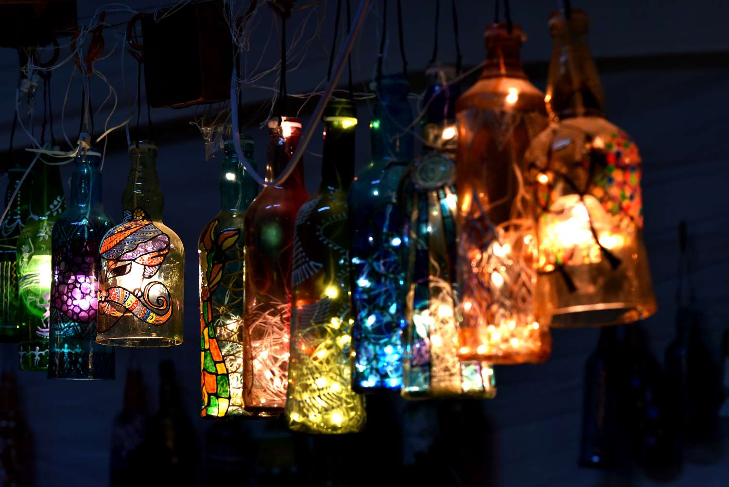 Lights inside hanging bottles