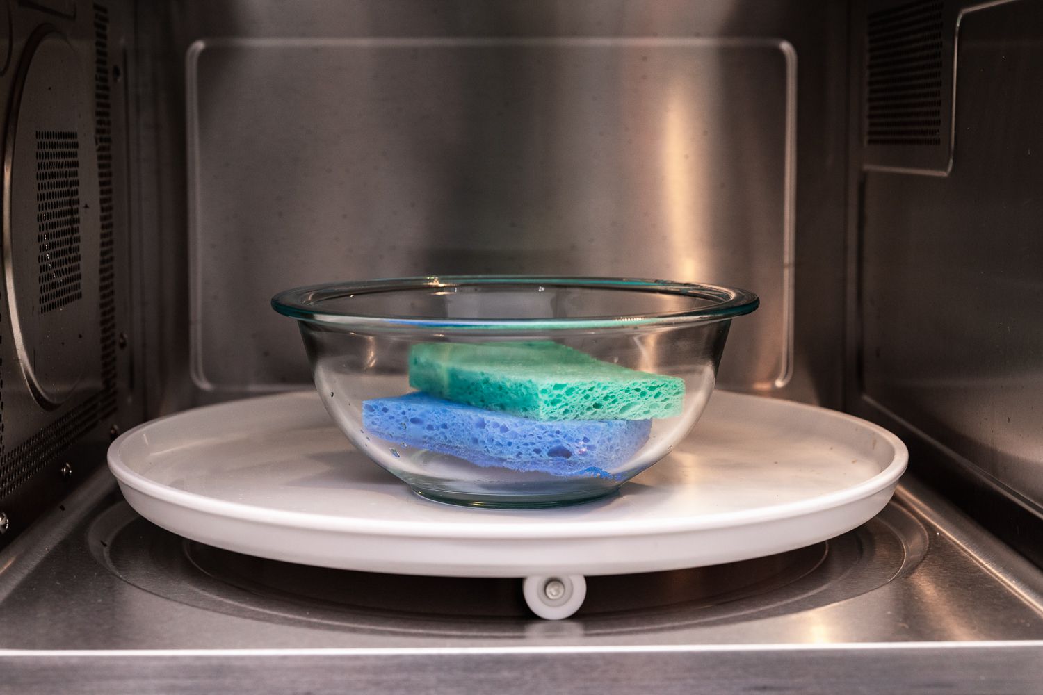 Soaking sponges in a microwave safe bowl