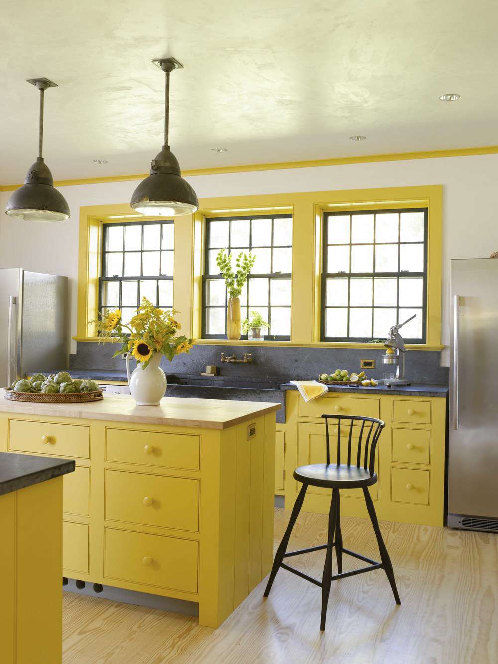 yellow kitchen with soapstone and butcher block countertops