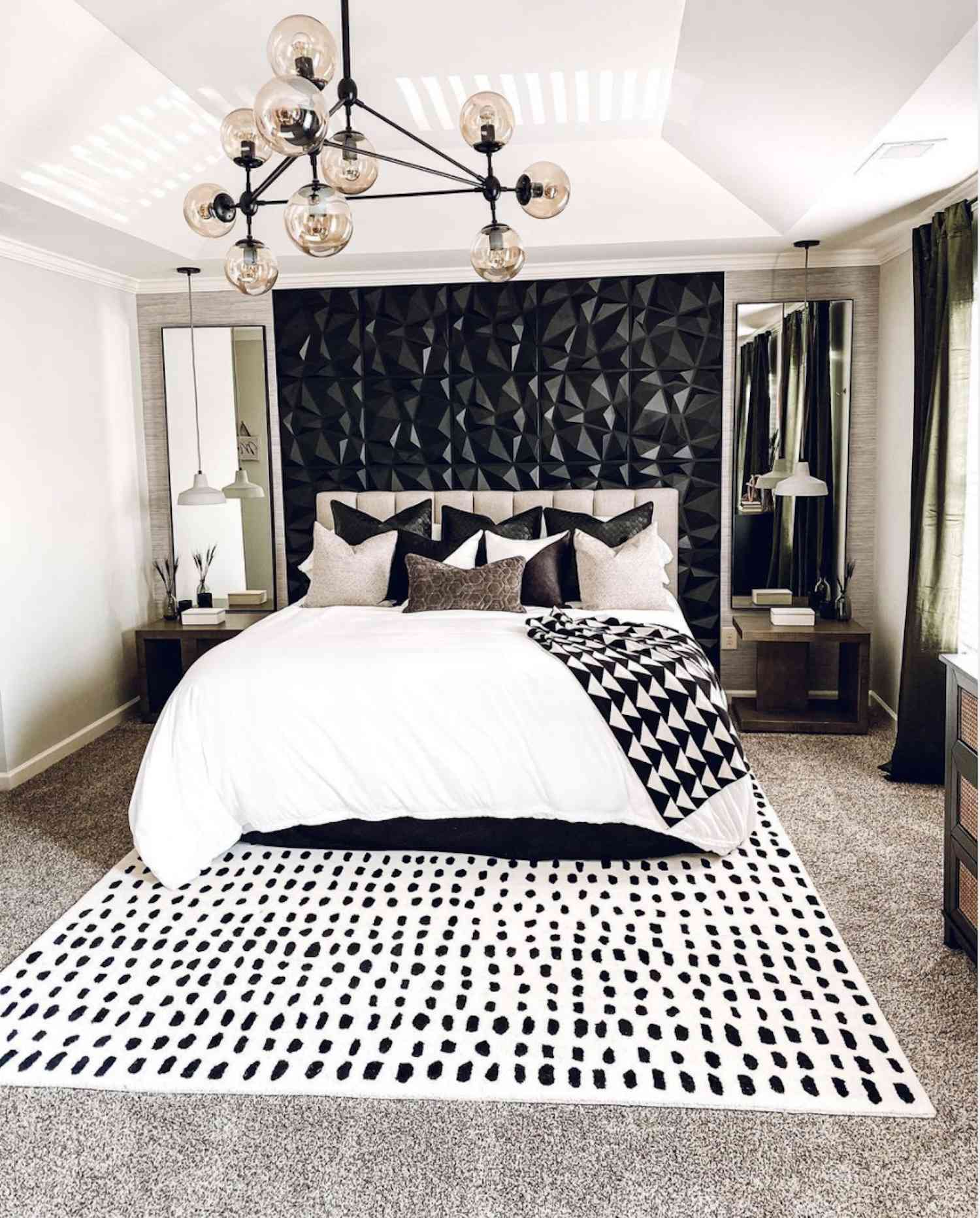black and white modern bedroom with black geometric textured accent wall