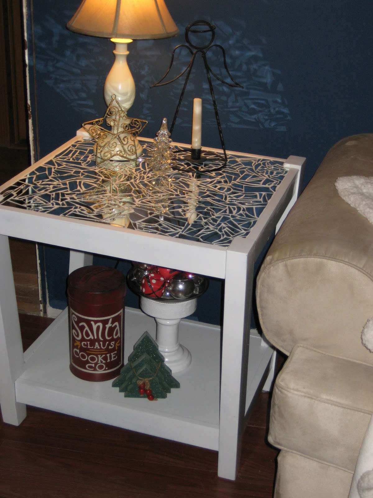 An end table covered with broken mirror pieces
