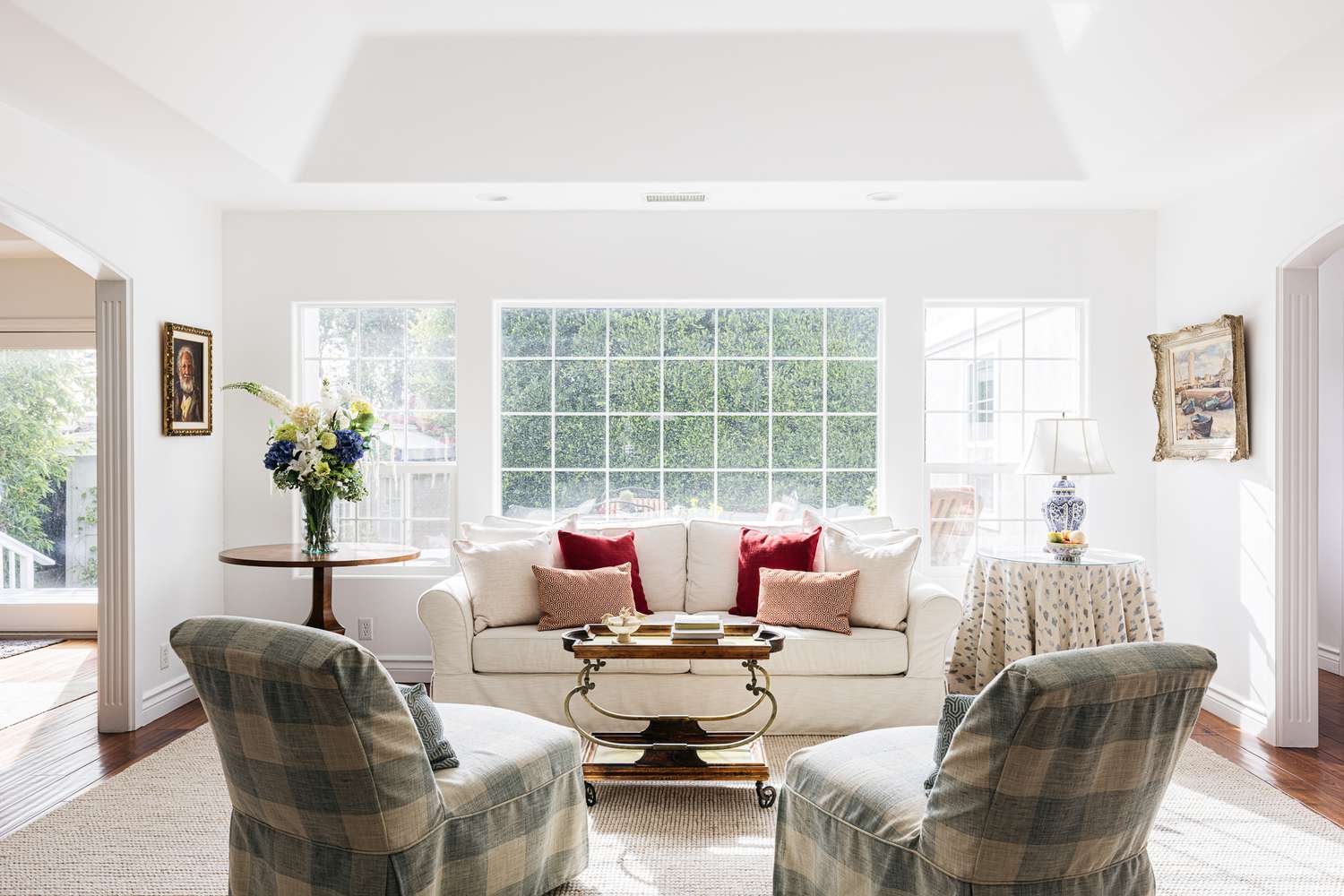 Large windows with bright light filtering into sitting area