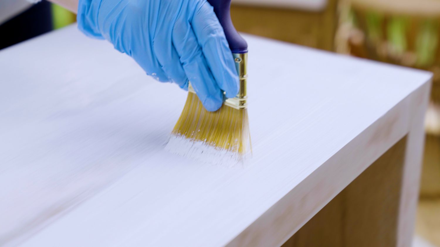 Applying primer to particle board furniture