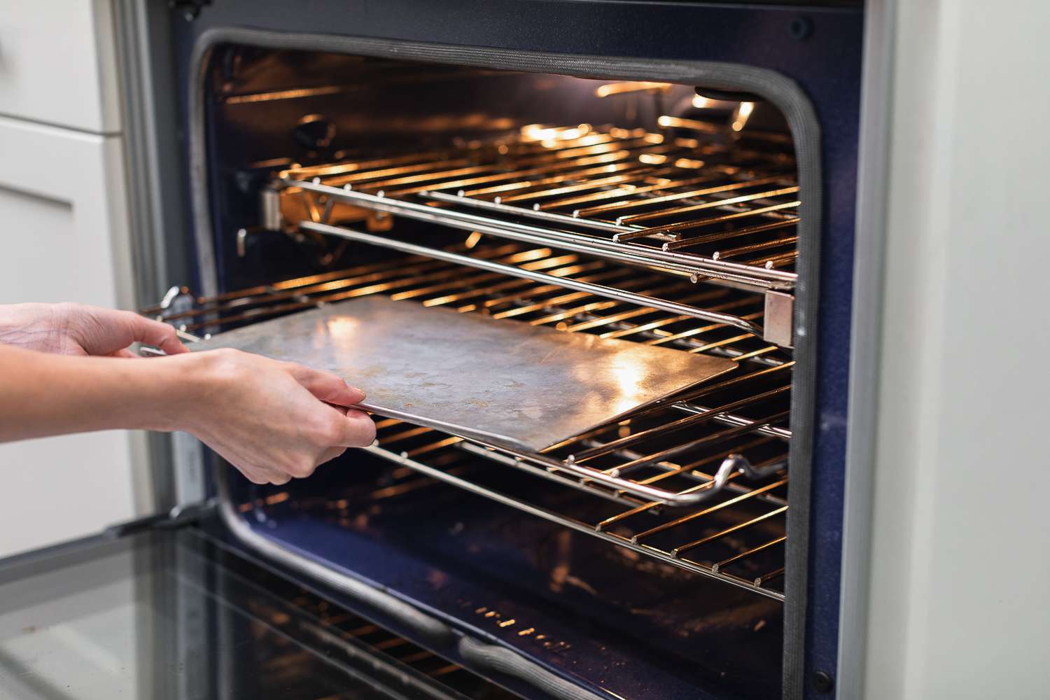 Baking sheet removed from inside oven racks