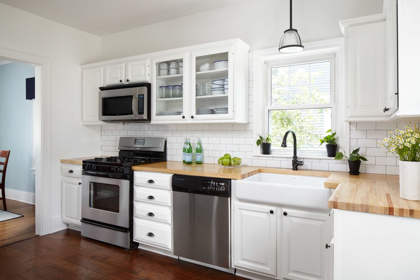 Butcher block countertops in black and white kitchen