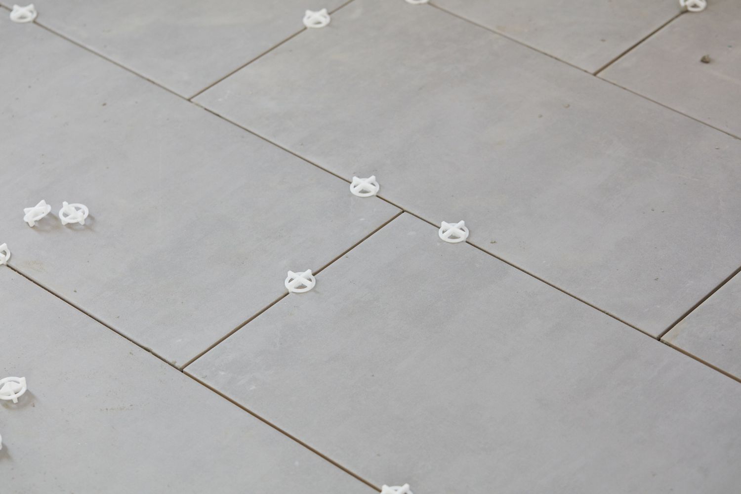 Chosen tile pieces with white spacers in between