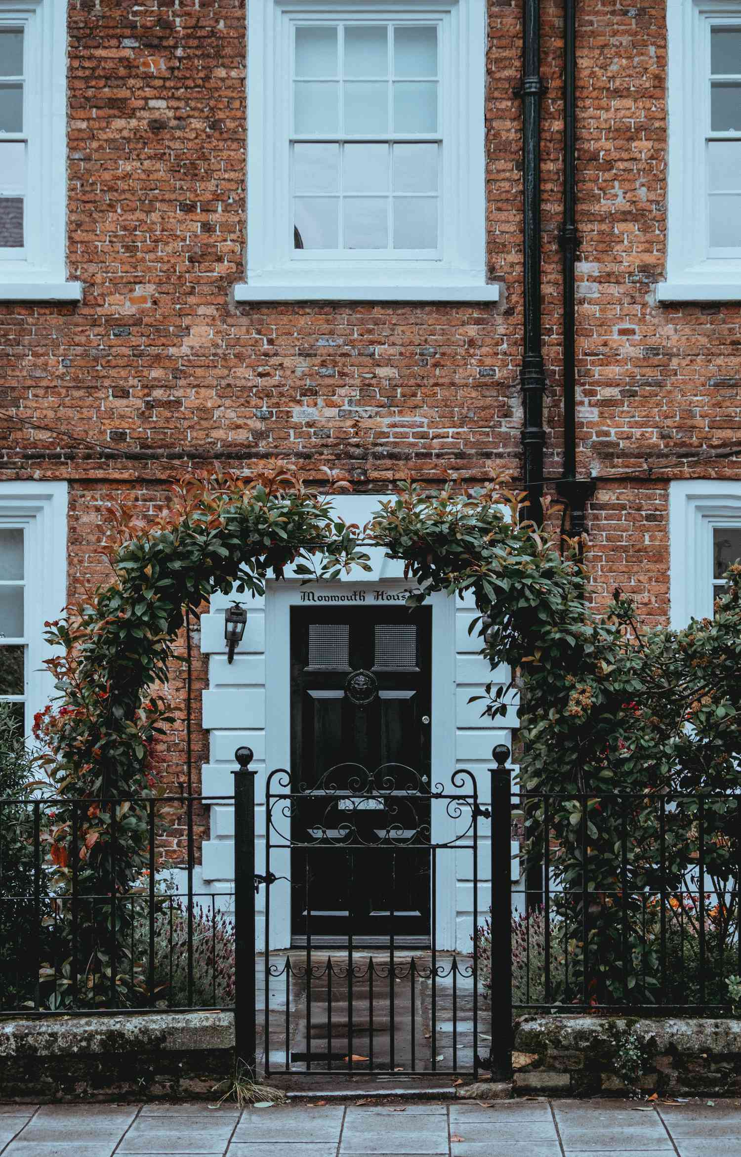 black front door of a brick house