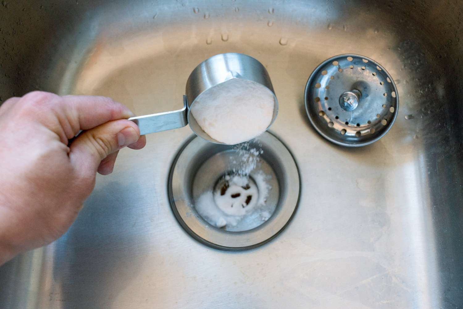 Cup of baking soda poued down stinky kitchen drain