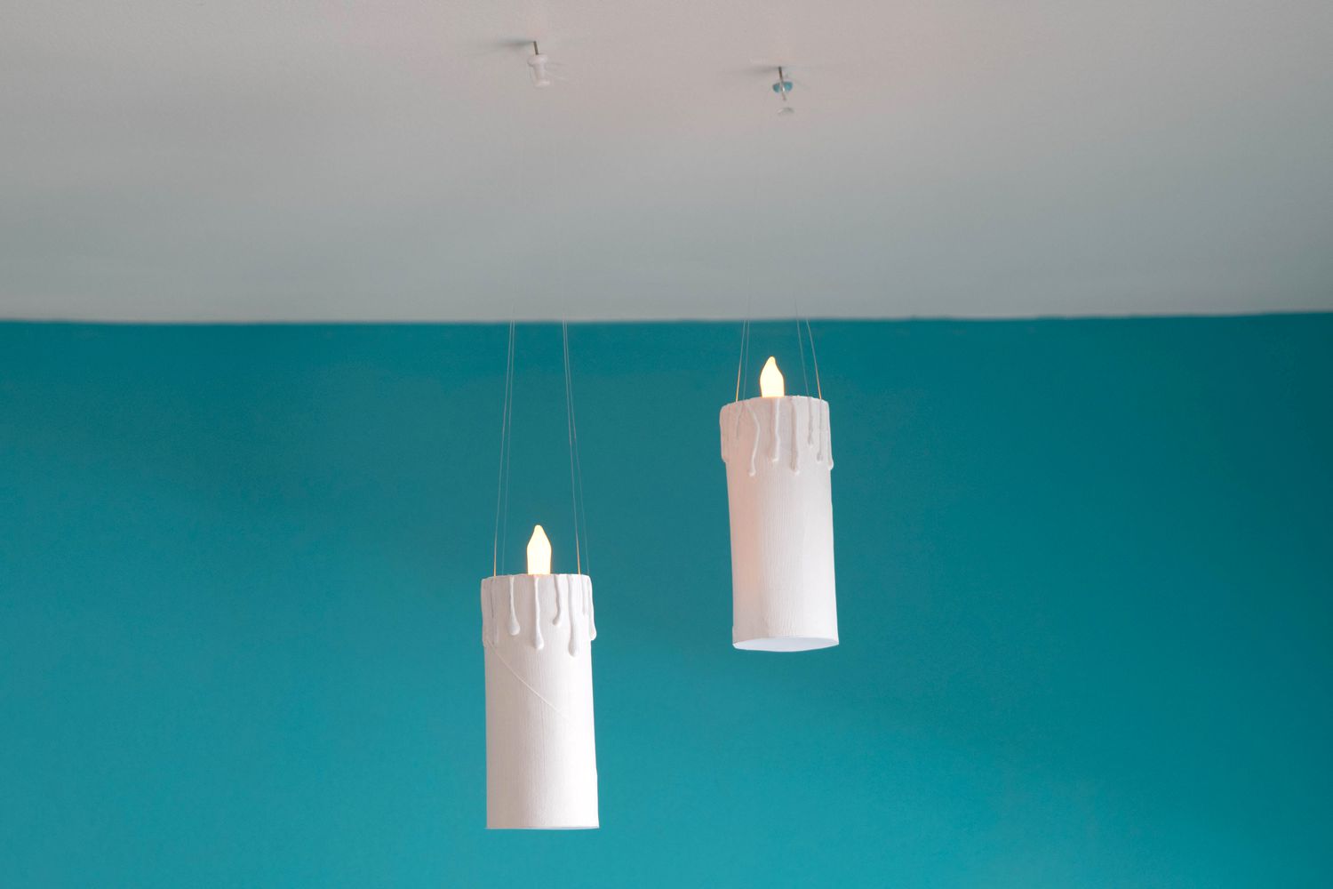 DIY candles floating from ceiling with clear fishing line