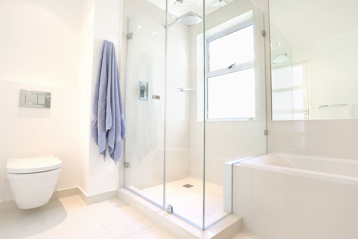 Modern domestic bathroom with window in shower