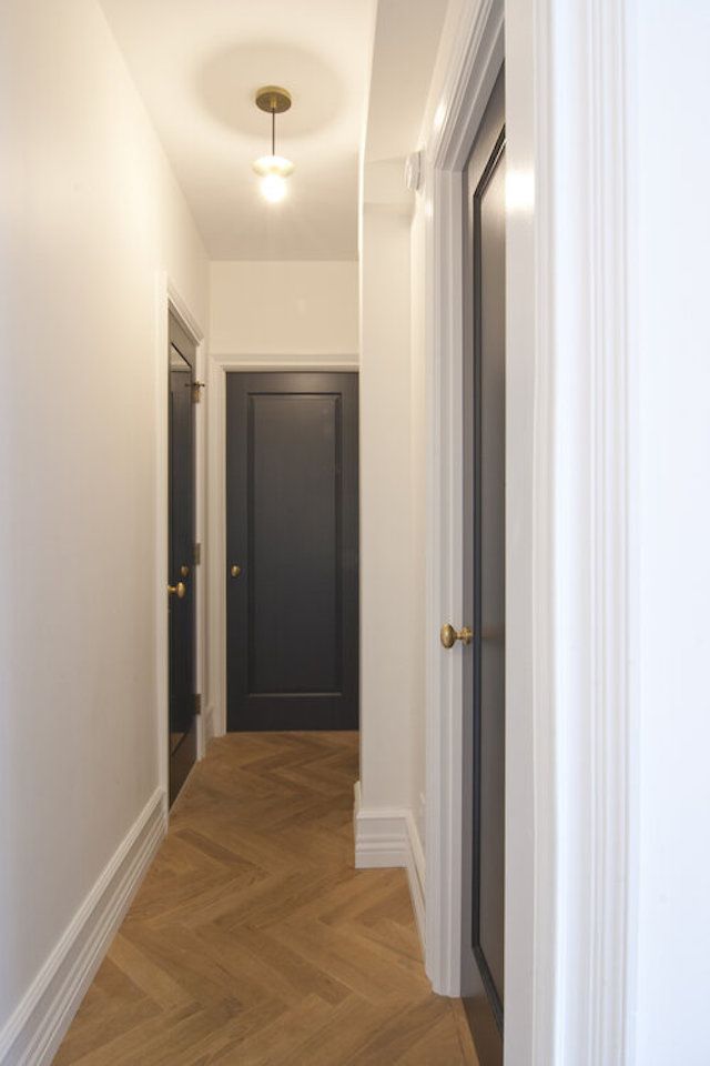 black doors in a hallway