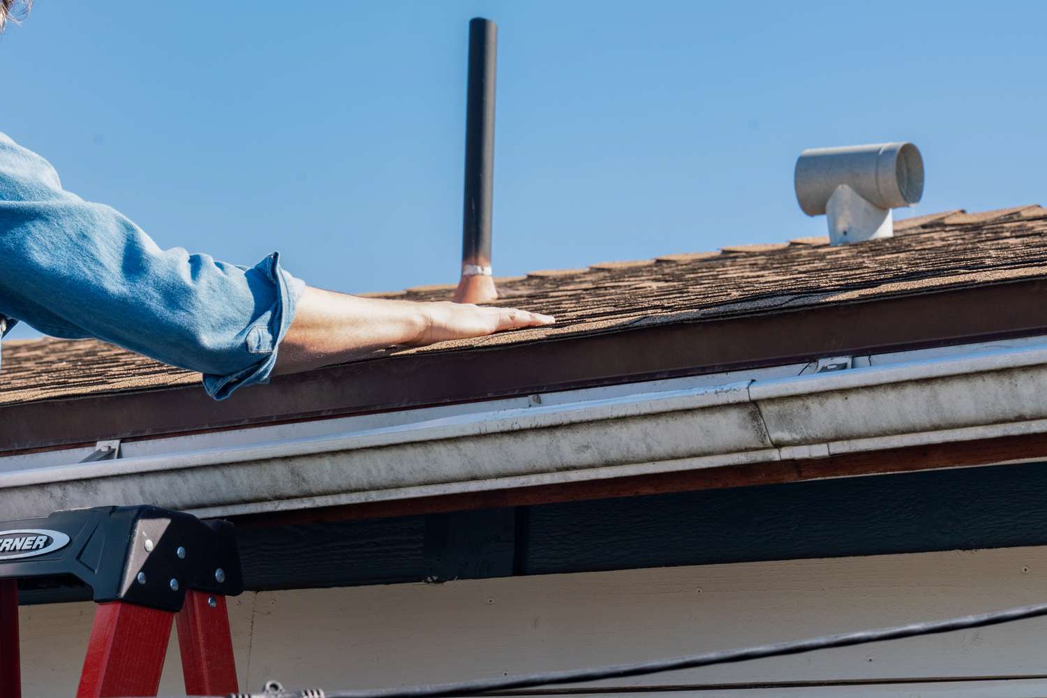 Air venting being checked on roof