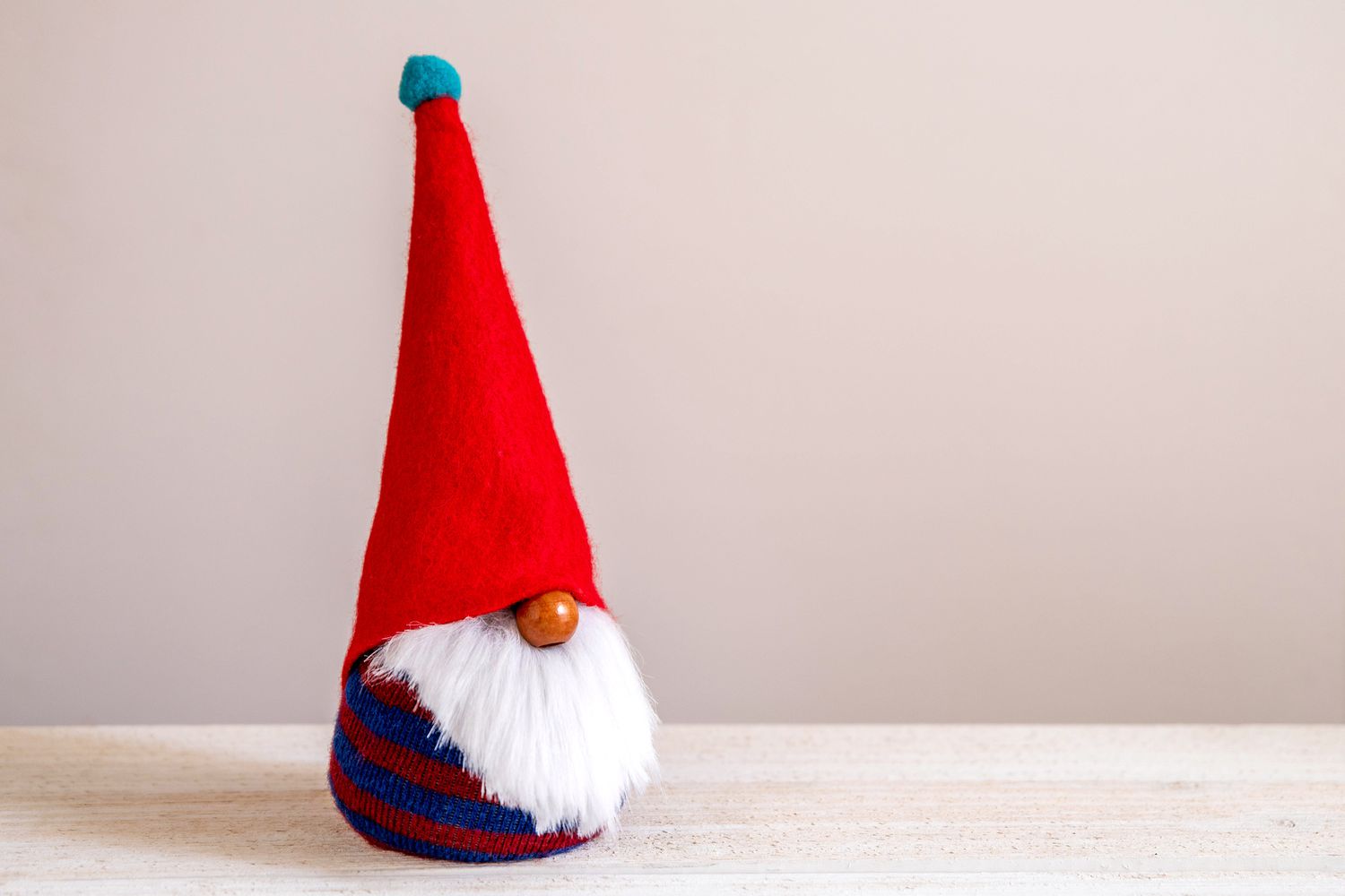 DIY garden gnome with pointy red hat & white faux fur beard