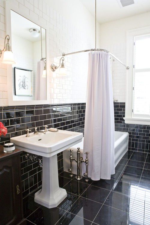 Black and white bathroom with an odd tub placement