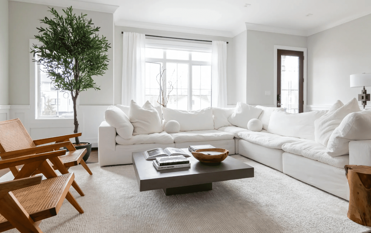 neutral all-white living room white sofa