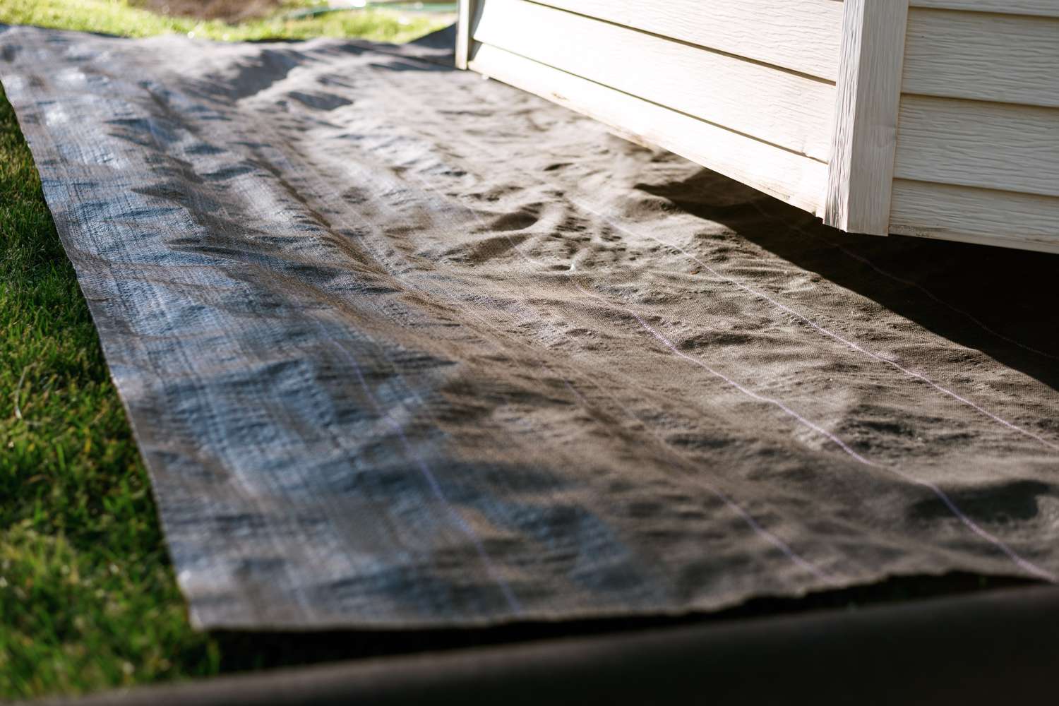 laying out landscape fabric