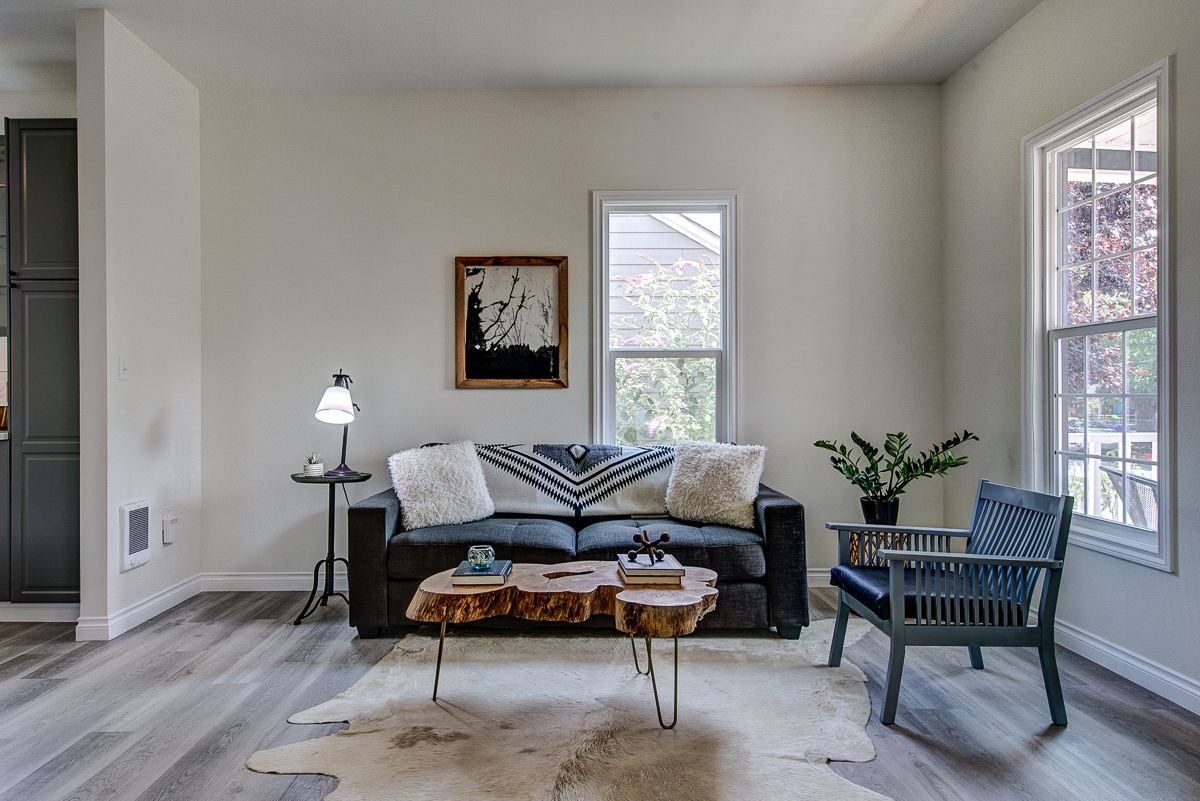 couch with blanket draped over