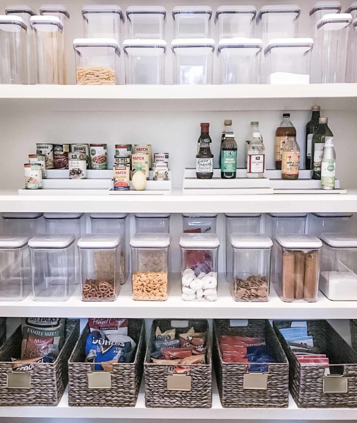pantry with clear containers and baskets to keep snacks