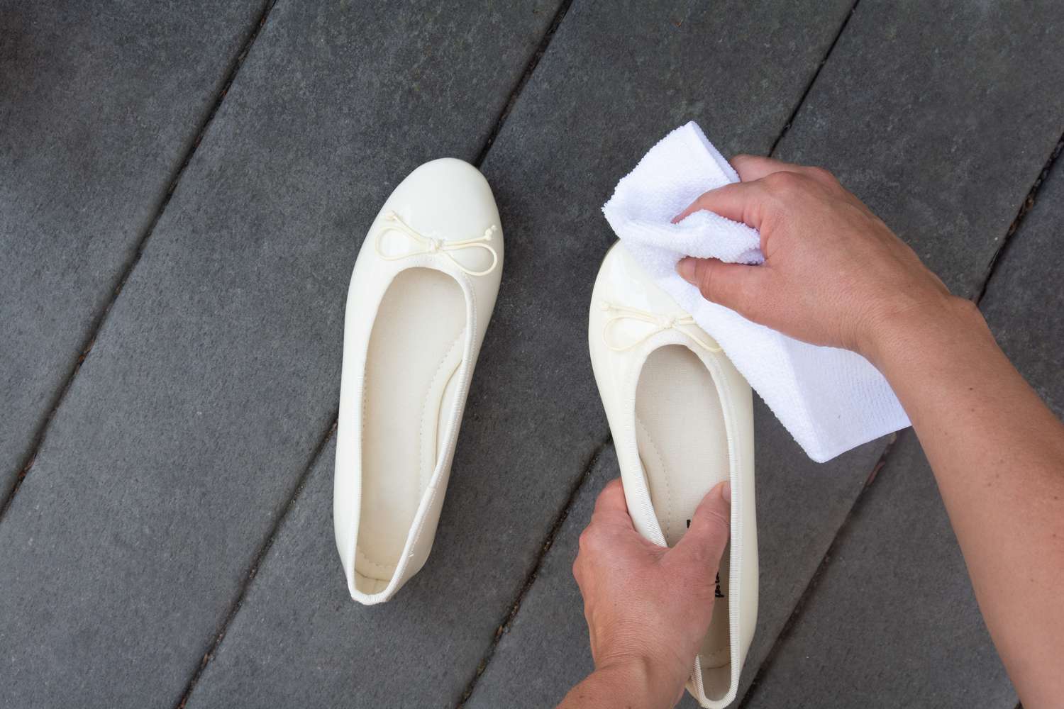 White patent leather shoes wiped white cloth and water