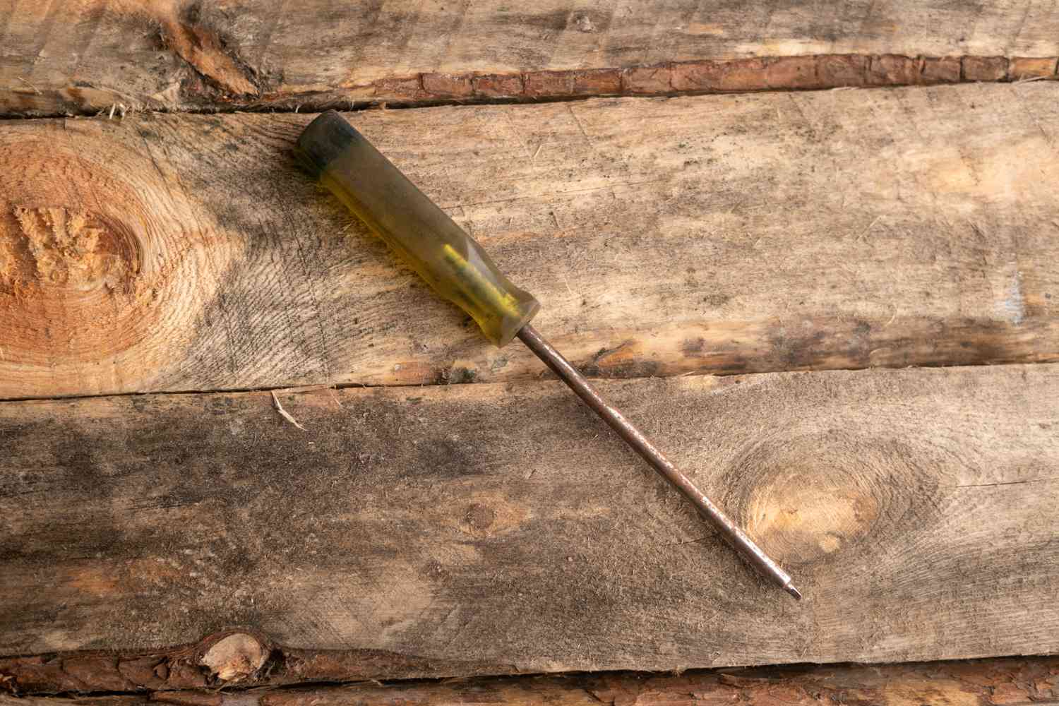 A yellow and black clear handle robertson screwdriver