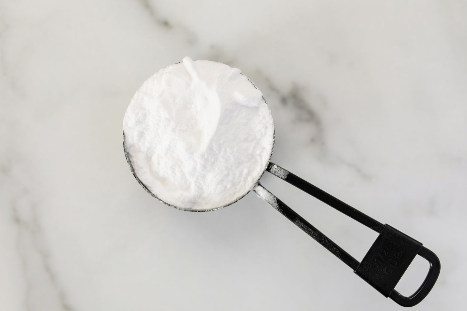 measuring cup of baking soda