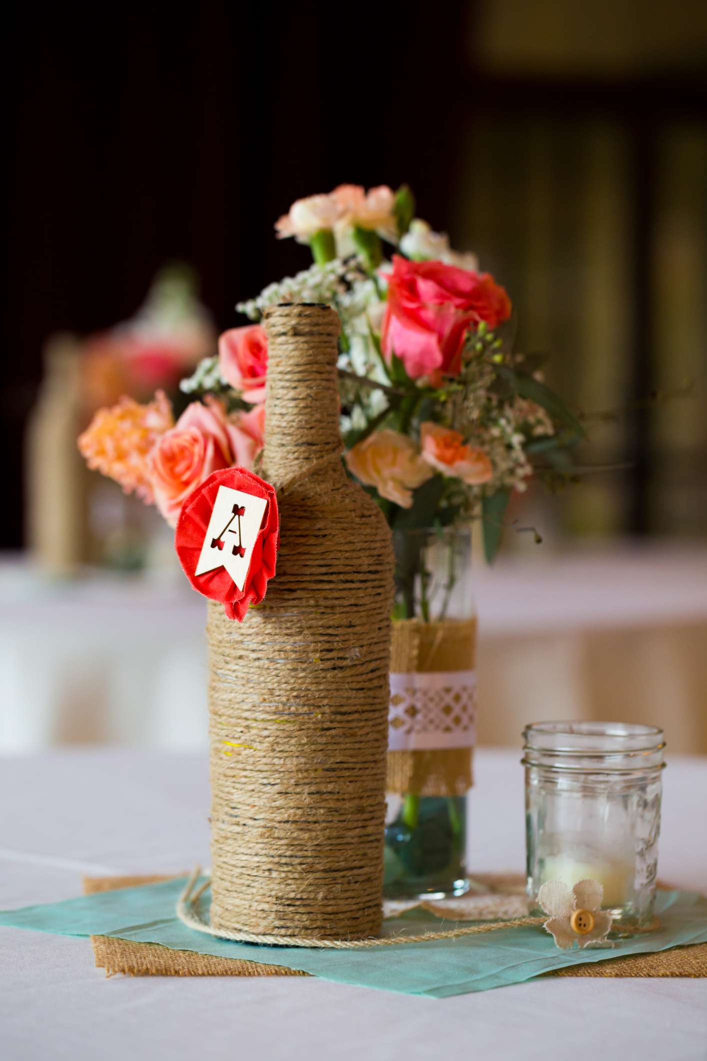 Twine wrapped bottle as part of a table centerpiece