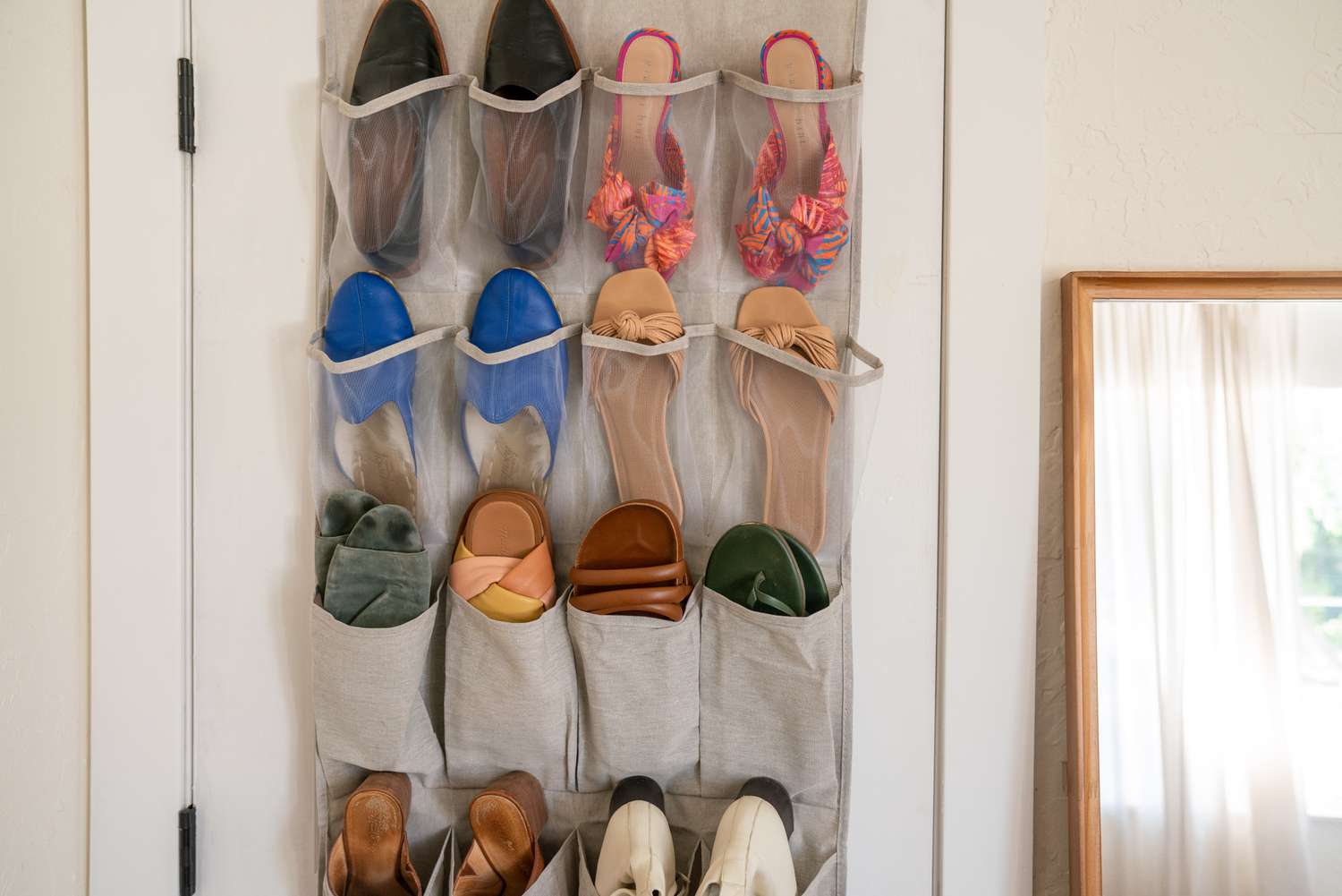 Over the door organizer storing shoes