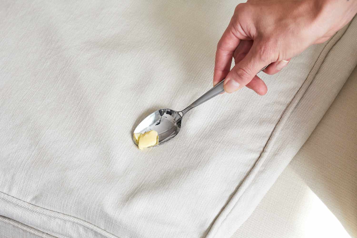 Removing butter solids with a spoon