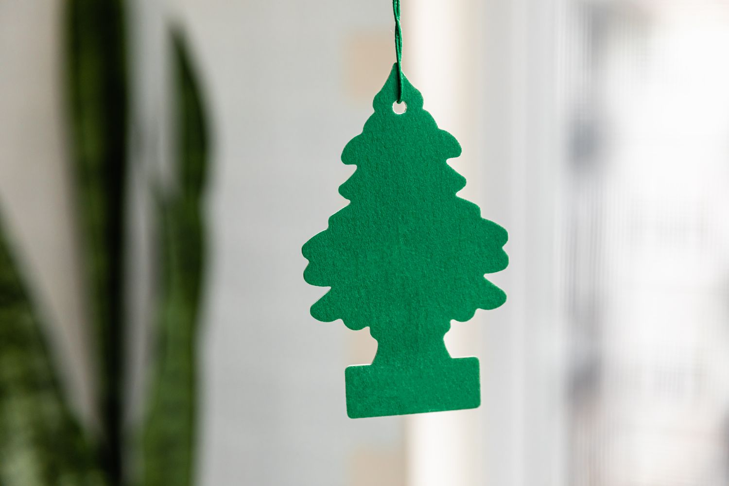 Pine-scented disinfectant tree hanging from string closeup