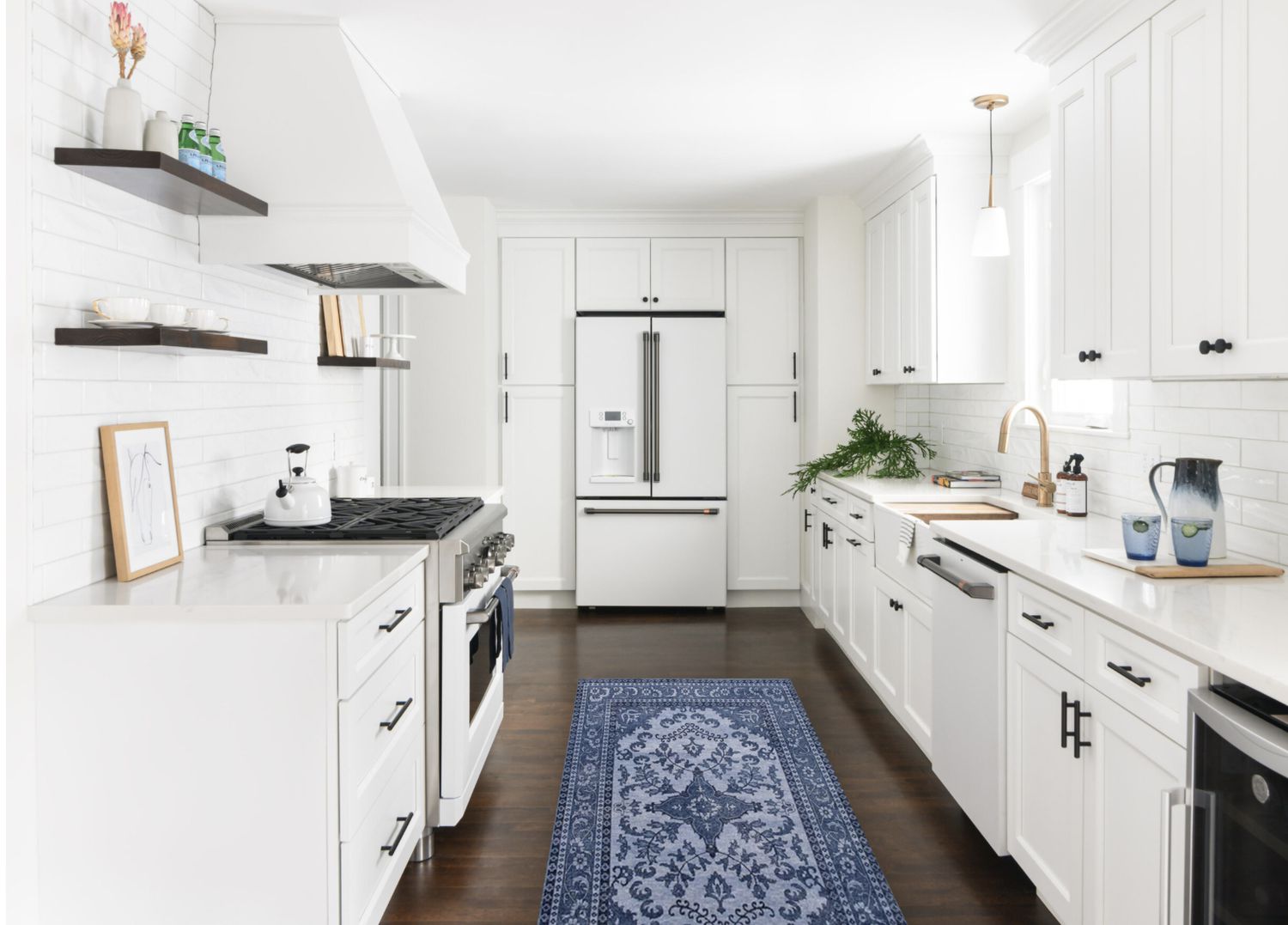 all white kitchen with modern appliances