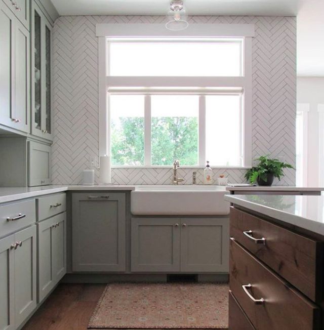 a gray kitchen with a farmhouse sink