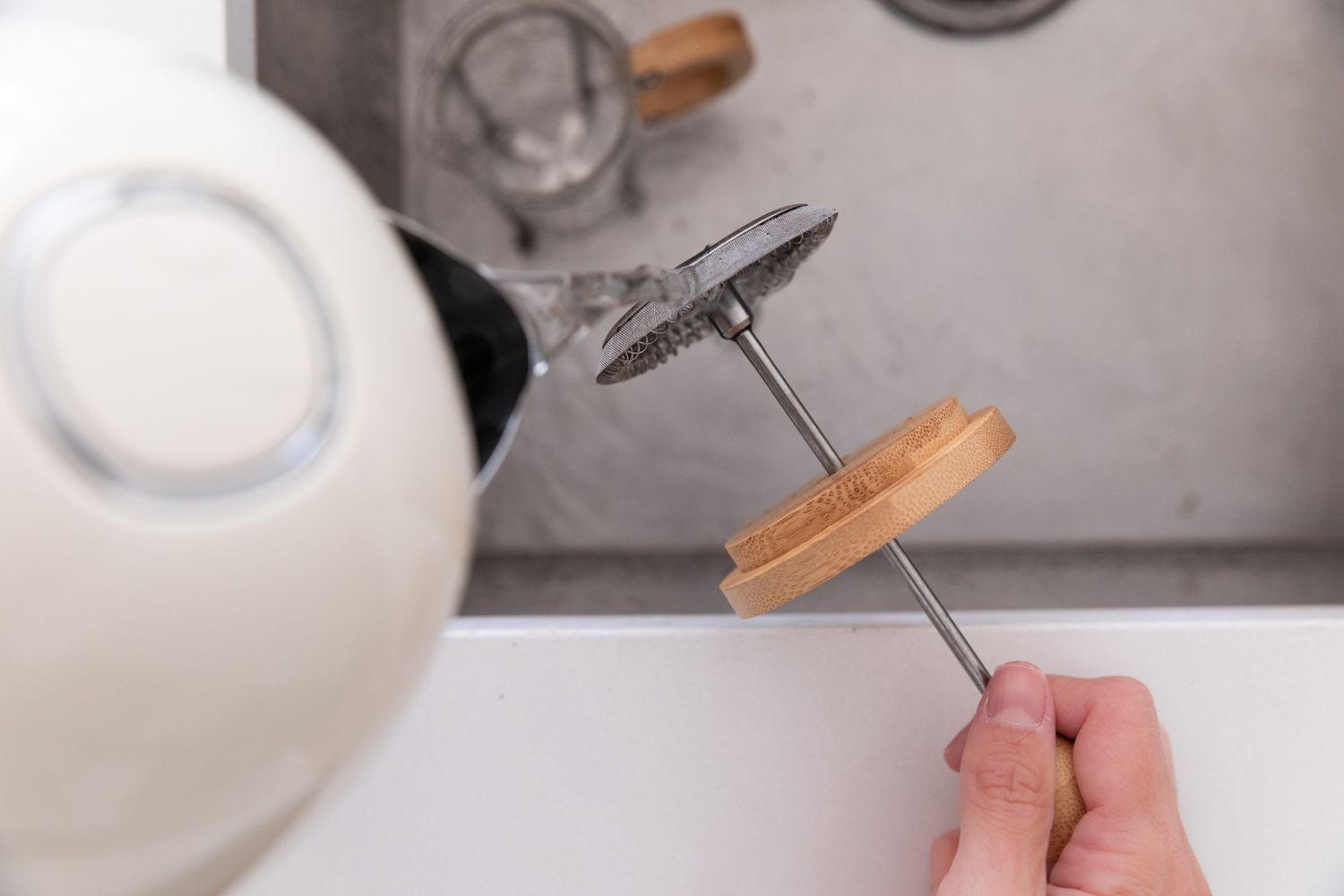 rinsing the plunger with hot water