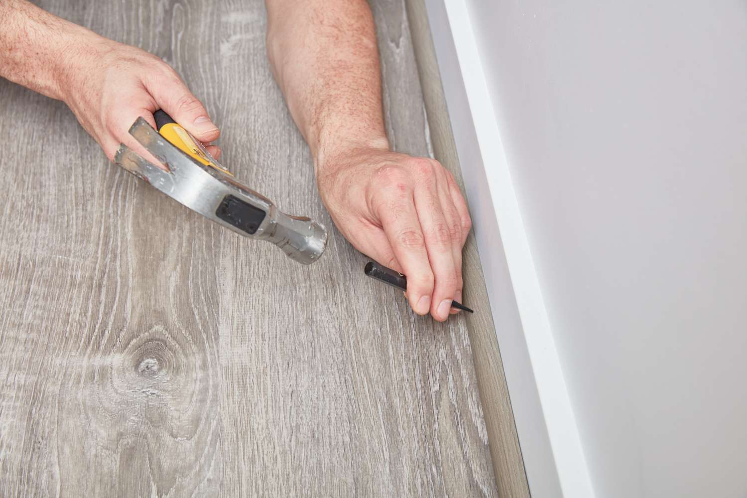 Flatten nails in baseboard