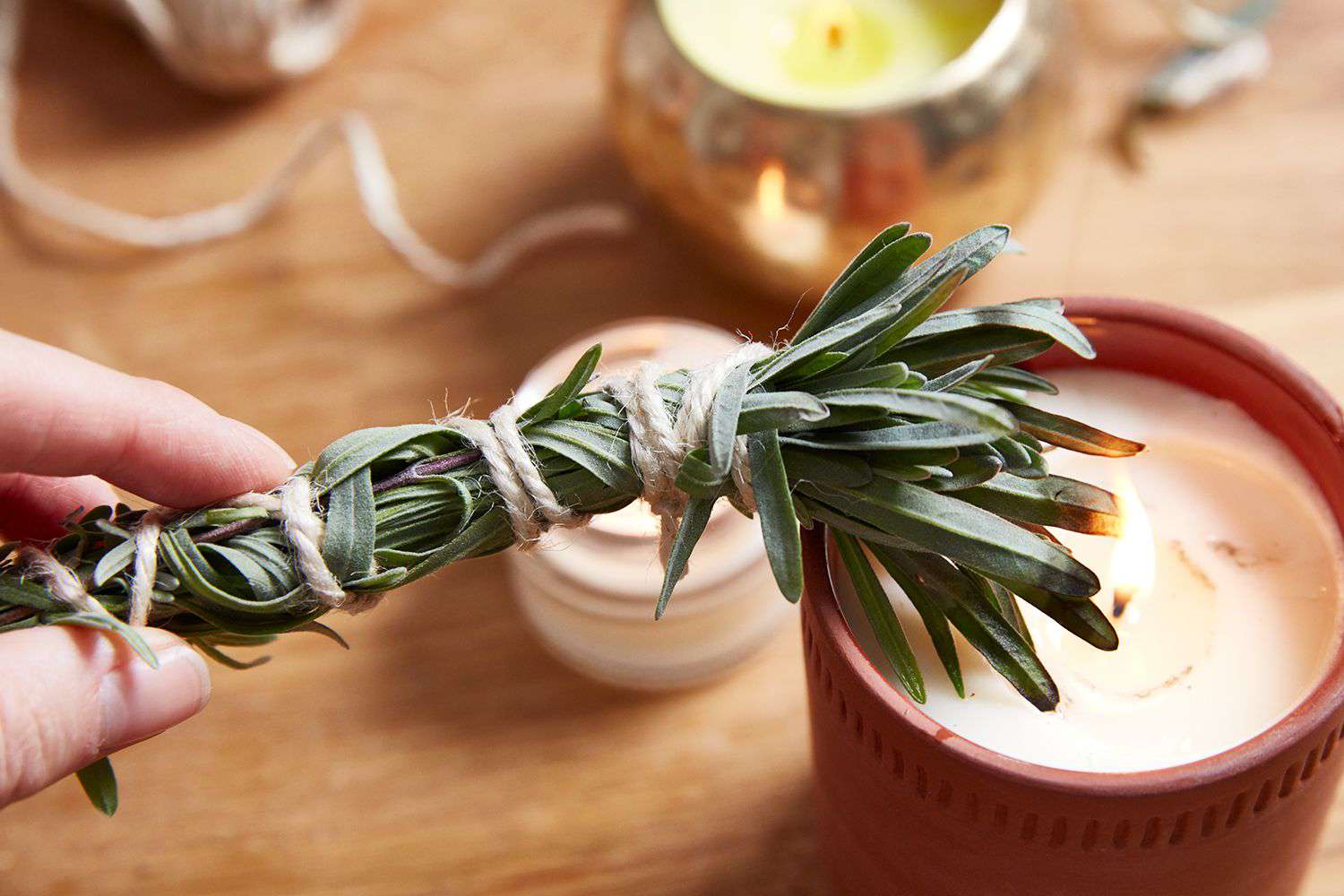 Person preparing to use smudging to clean the home