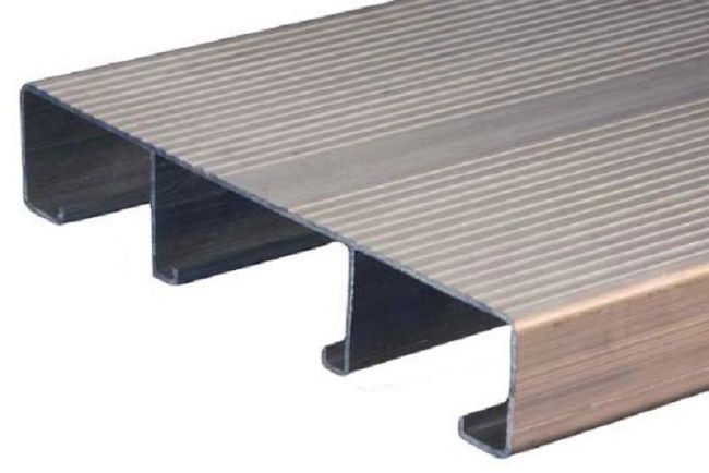 An uninstalled aluminum decking plank