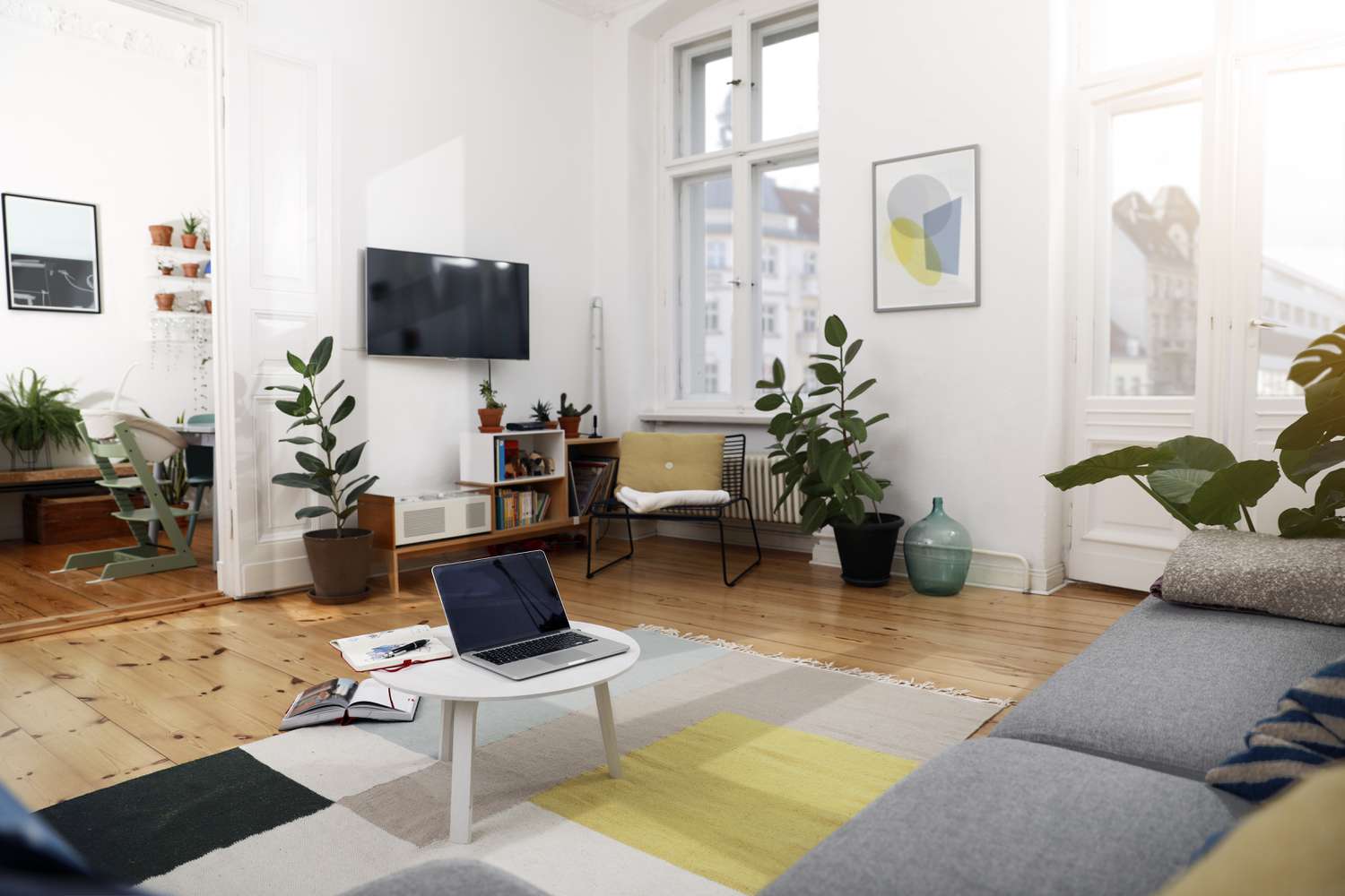 Laptop on a coffee table in a modernly furnished flat