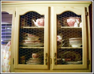 pink and white china in wire cabinets