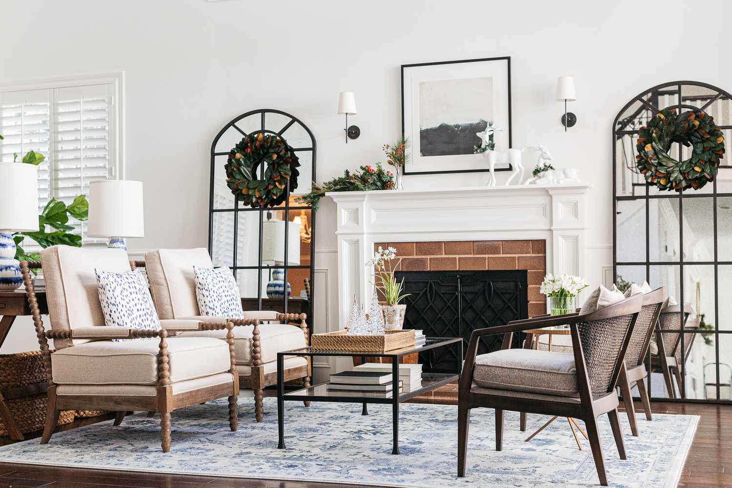 Modern tidy living room with holiday wreaths.