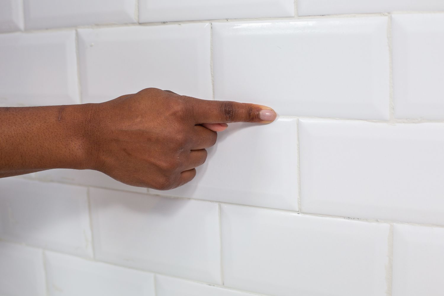 Grout joints tooled with finger to smooth out irregularities