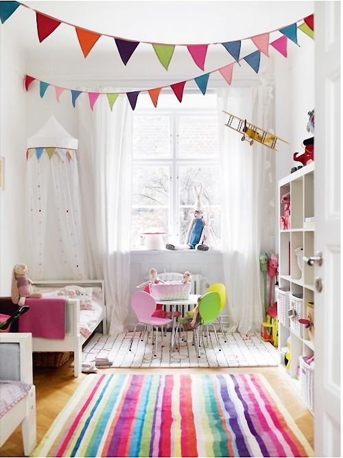 White nursery with bright, colored accents