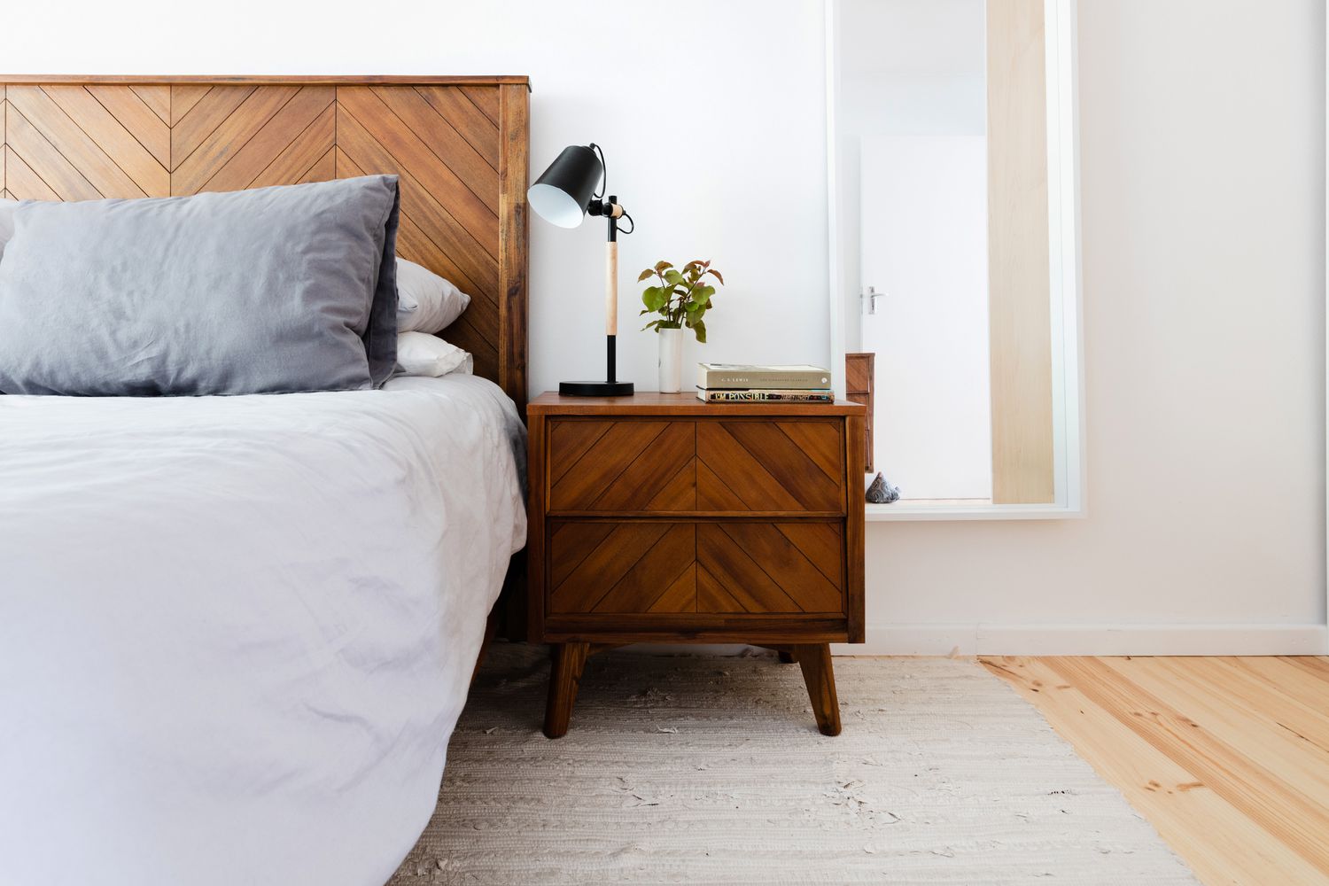 area rug placement in a small bedroom