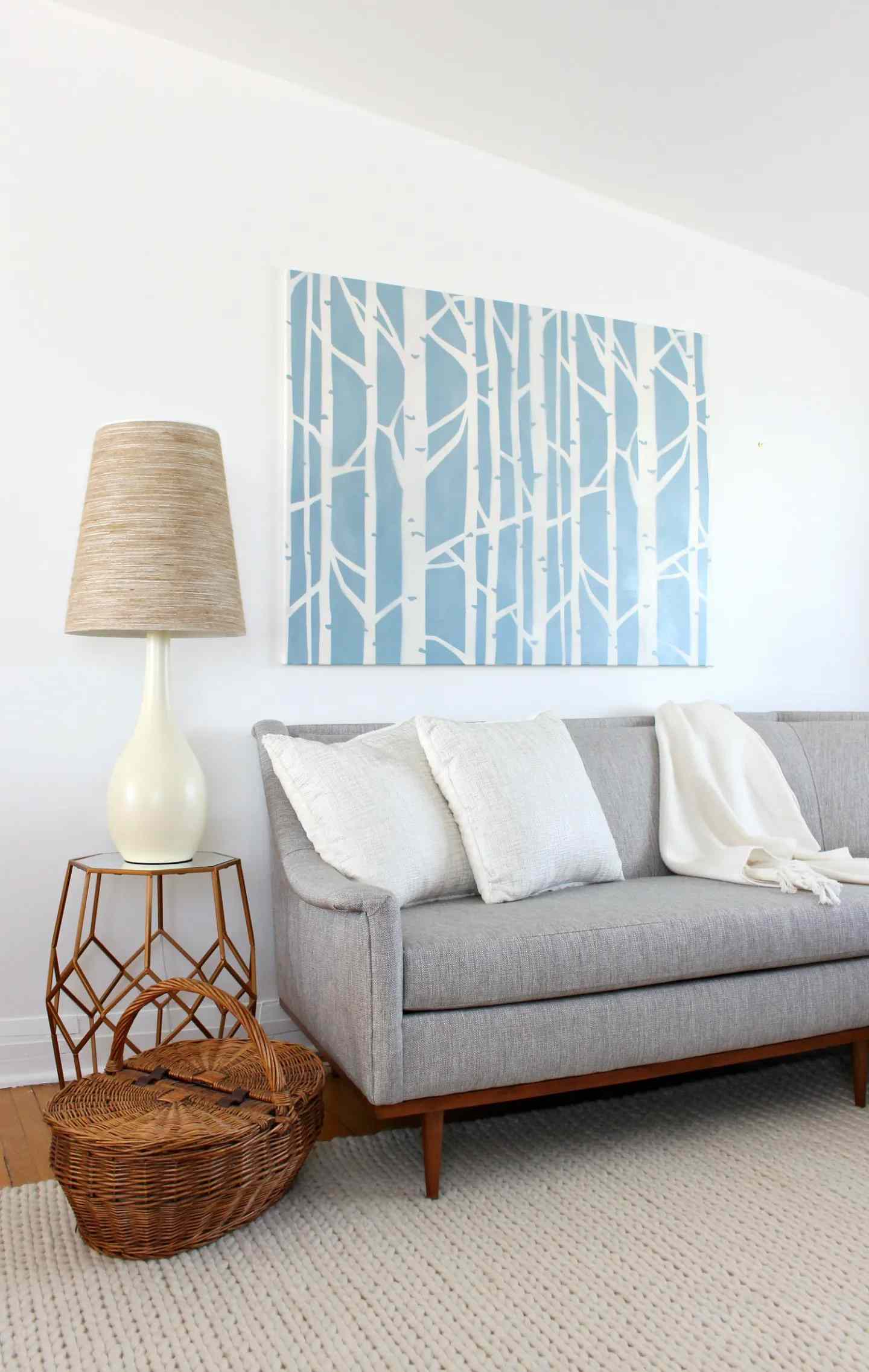 A large blue and white tree art in a living room