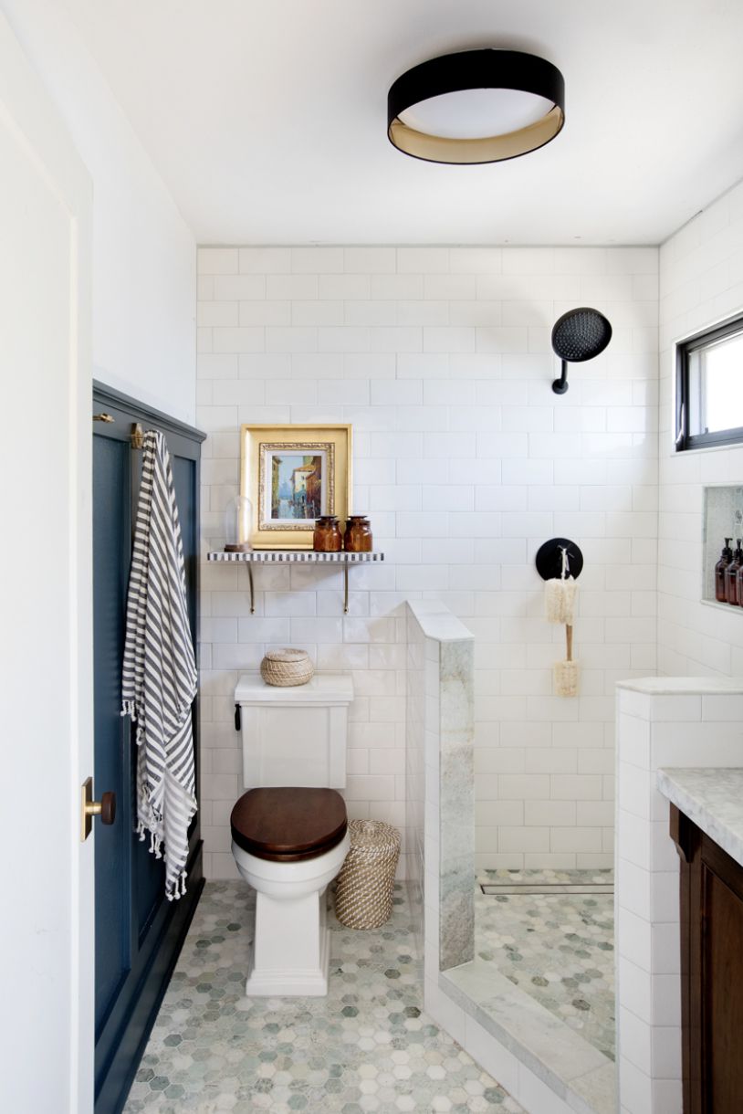 bathroom with navy wain scotting on one wall