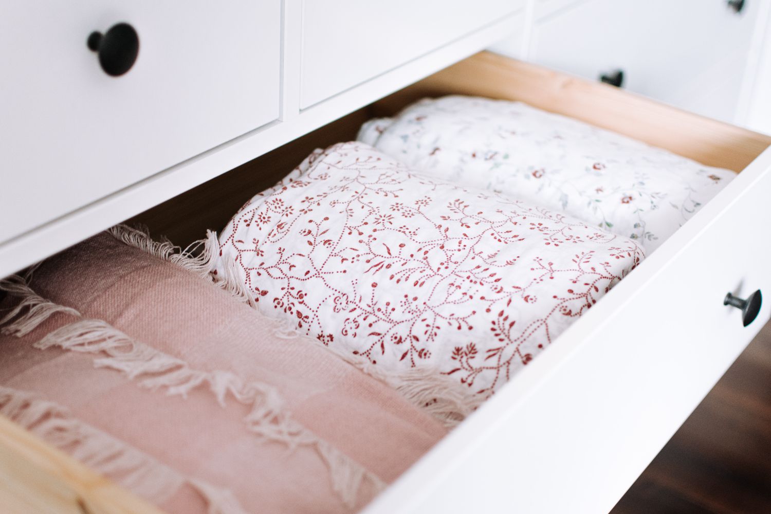 linens stored in a dresser drawer
