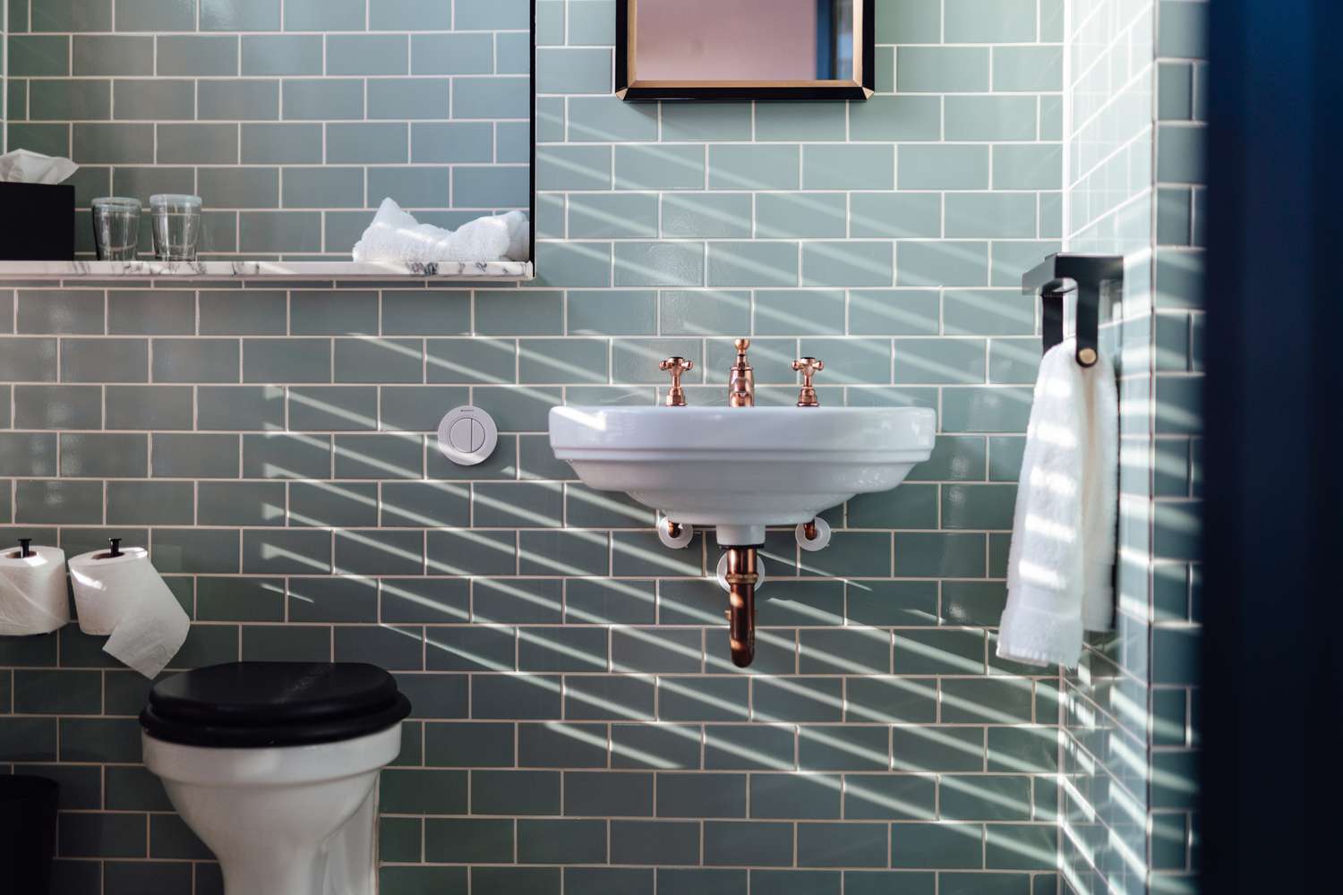 Sunlight coming through from the window in a stylish bathroom