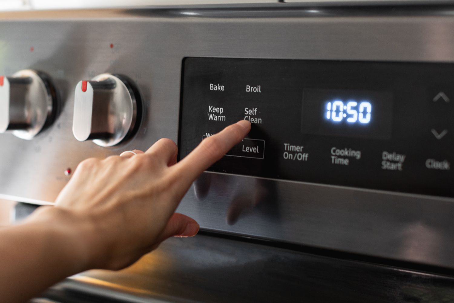 Self-clean cycle button pressed on oven
