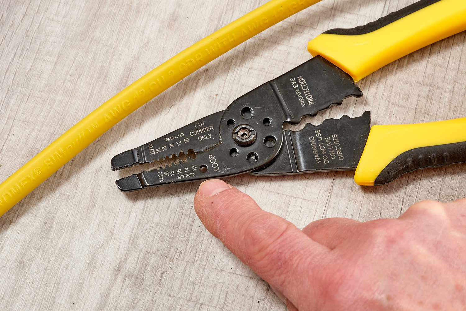Wire gauge matched to hole size on wire stripper tool