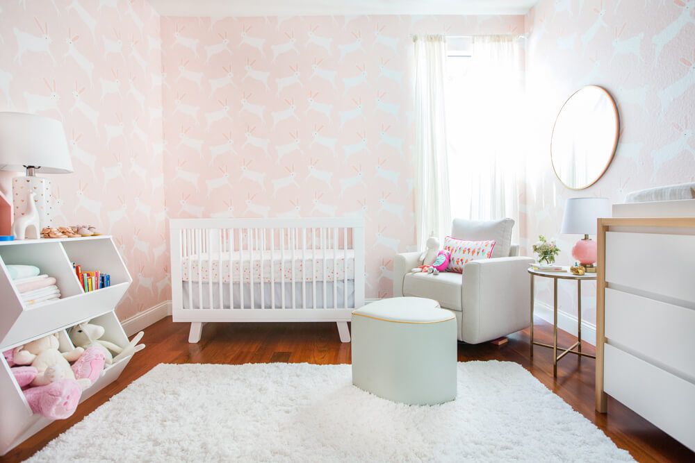 Bunny-themed animal nursery with pink wallpaper